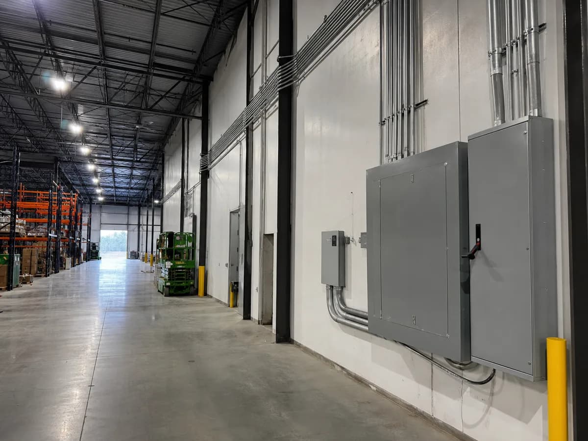 Industrial distribution panels and conduit in a warehouse